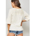 A Knit Top With Deep V Neckline And Yoke Design
