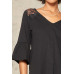 A Knit Top With Deep V Neckline And Yoke Design