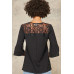 A Knit Top With Deep V Neckline And Yoke Design