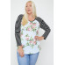 Floral Top Featuring Raglan Style Striped Sleeves And A Round Neck